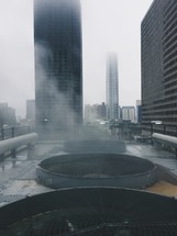 fans on a roof, skyscraper, city, cityscape, fog, outdoors 
