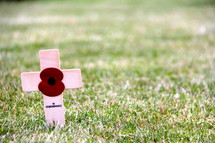 Remembrance cross and red poppy from the fields of Flanders, France, site of World War 1 battles