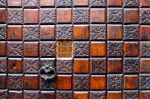 door pull on an ornate wood door 