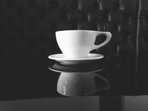 cup and saucer on a diner table 