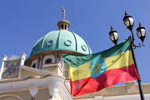 Ethiopian Orthodox cathedral and national flag. 