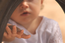 Infant child reaching out a hand.