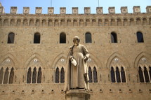 Statue of a Saint in front of a Cathedral
