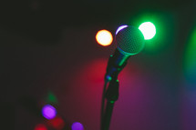 Microphone on a lighted stage.