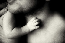 closeup of a father holding his infant