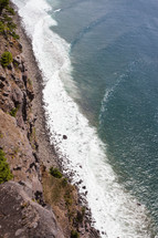 Aerial view of the ocean shoreline and waves,