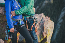 a couple hugging in climbing gear