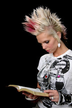 Woman, with a wild hairdo, standing, holding a bible