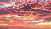 Epic red sky clouds over ocean beach in summer sunrise nature Time lapse
