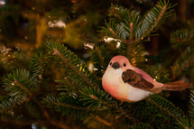 A bird in a Christmas tree. 