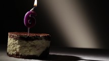 Candle six in tiramisu cake