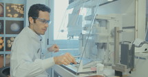 Lab technician working in a pharmaceutical laboratory conducting experiments