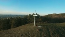white cross on a mountaintop 