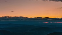 Sunrise sky above countryside nature landscape time-lapse travel background
