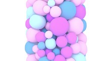 Colorful pastel pink and blue spheres arranged in a vertical column on a white backgroud