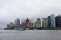 city sky scrapers in dense fog 