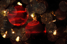 Red satin Christmas tree ornaments.