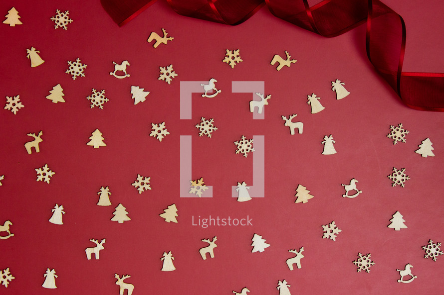 Christmas wooden cutouts on red 