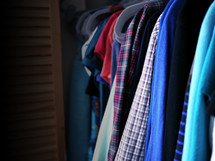 clothes hanging in a closet 