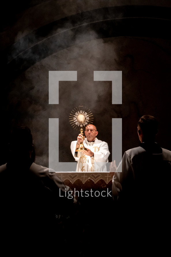 Eucharistic adoration - priest blessing