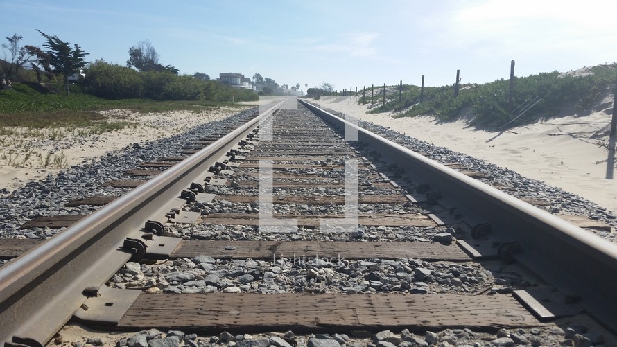 train tracks and sand 