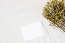 dried boouquet of flowers and stationary 