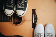 sneakers on a guitar 