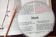 magnifying glass over Mark 