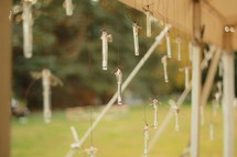 bubble wands hanging on string 