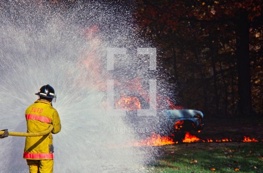 firefighter putting out a fire 