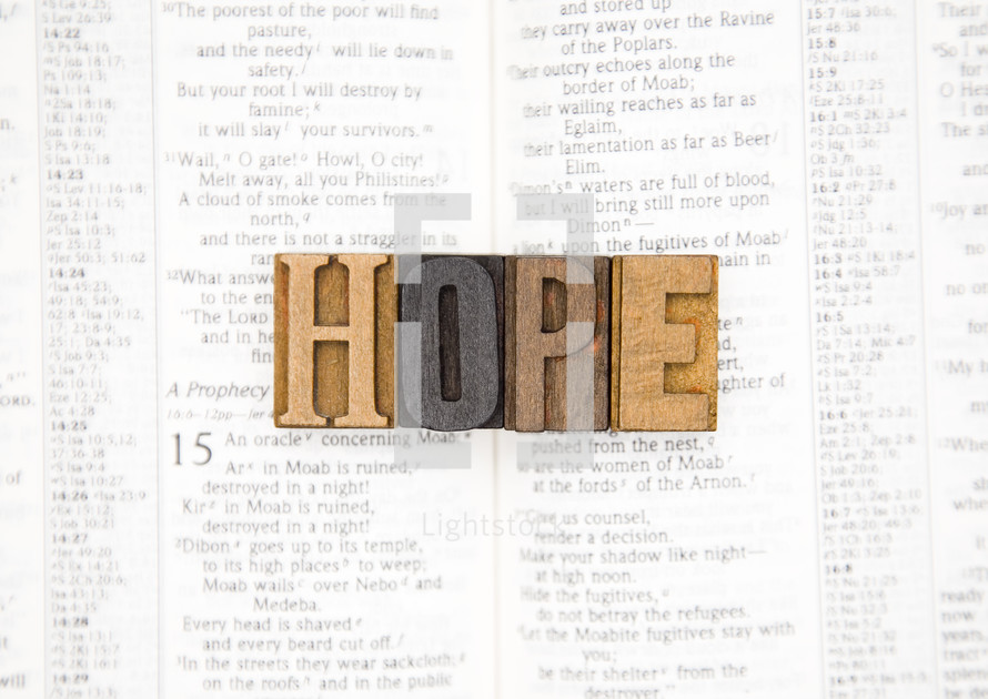 word hope on the pages of a Bible 