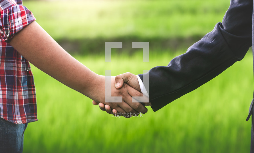 businessman and farmer shaking hands