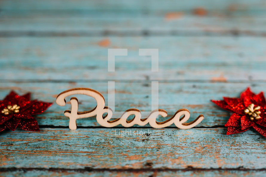 word peace on teal boards 