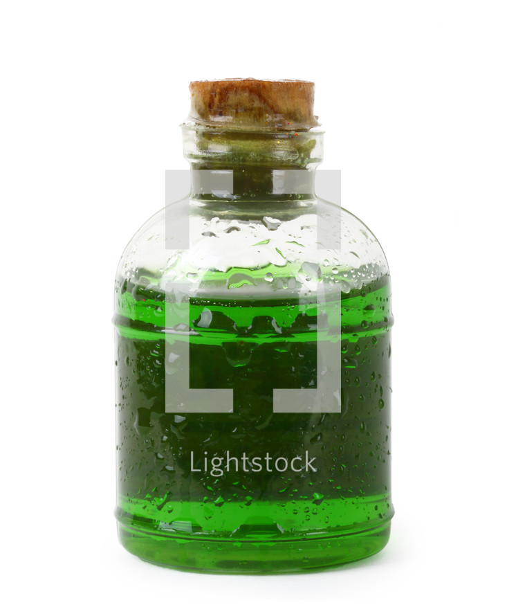 Bottle of green liquid isolated over white background