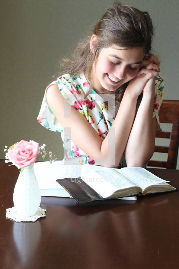 A girl studying the Bible.