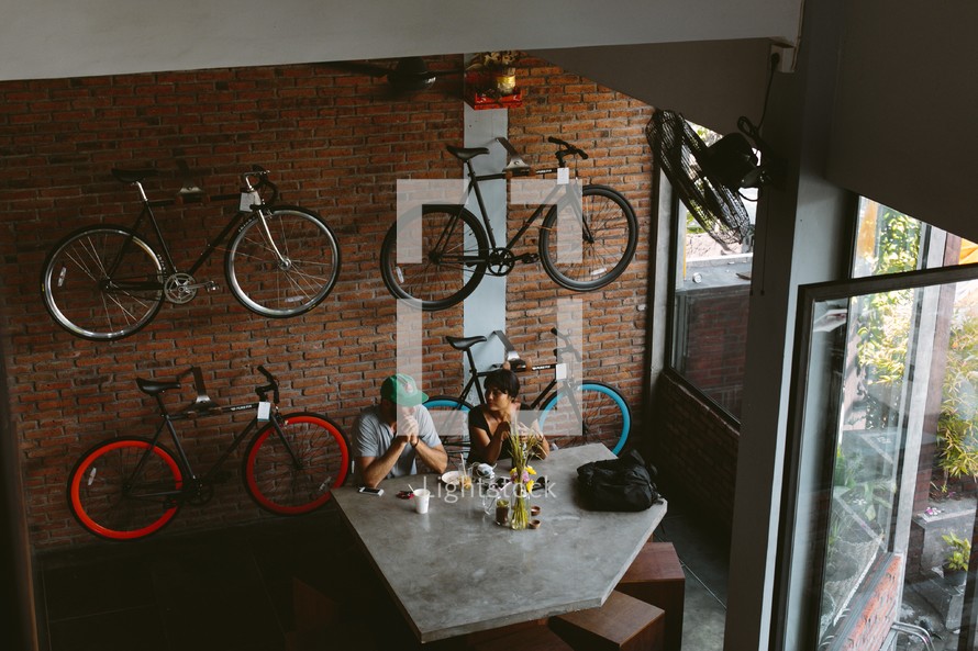 bikes hanging on a wall in a restaurant 