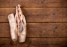 ballet shoes hanging on a hook