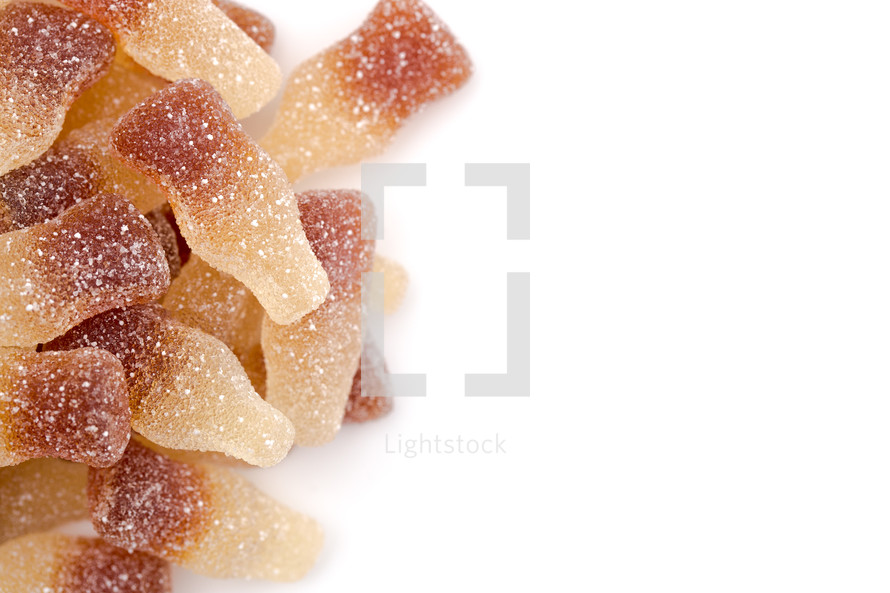Sweet and Sour Gummy Cola Bottles on a White Background