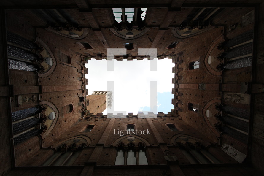 looking up at the sky through a cathedral's tower 