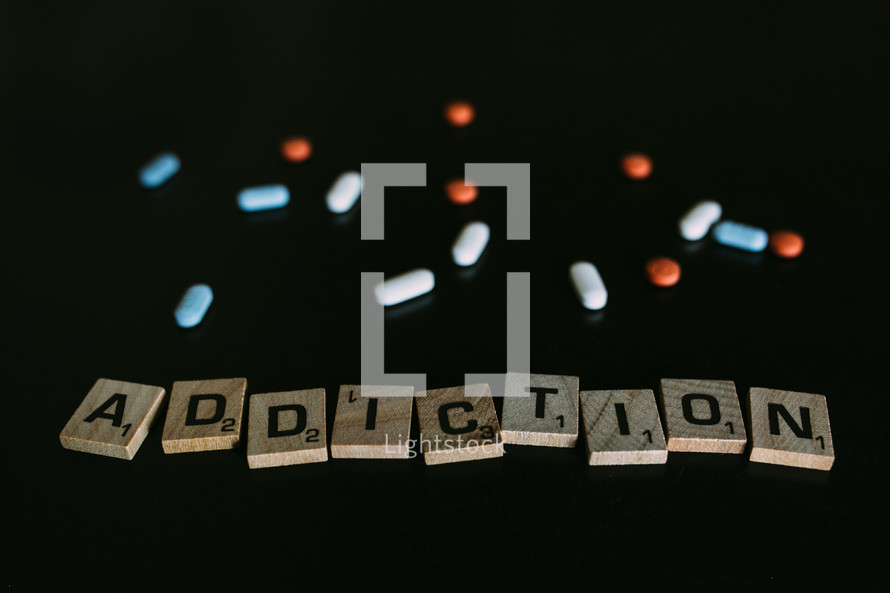 word addiction in scrabble pieces and pills 