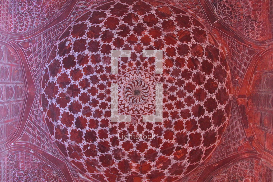 red and white radiating detail at the top of a dome 