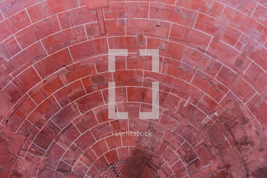 Red clay bricks laid in a circular pattern