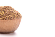 Pile of Ground Flax Seeds on a White Background
