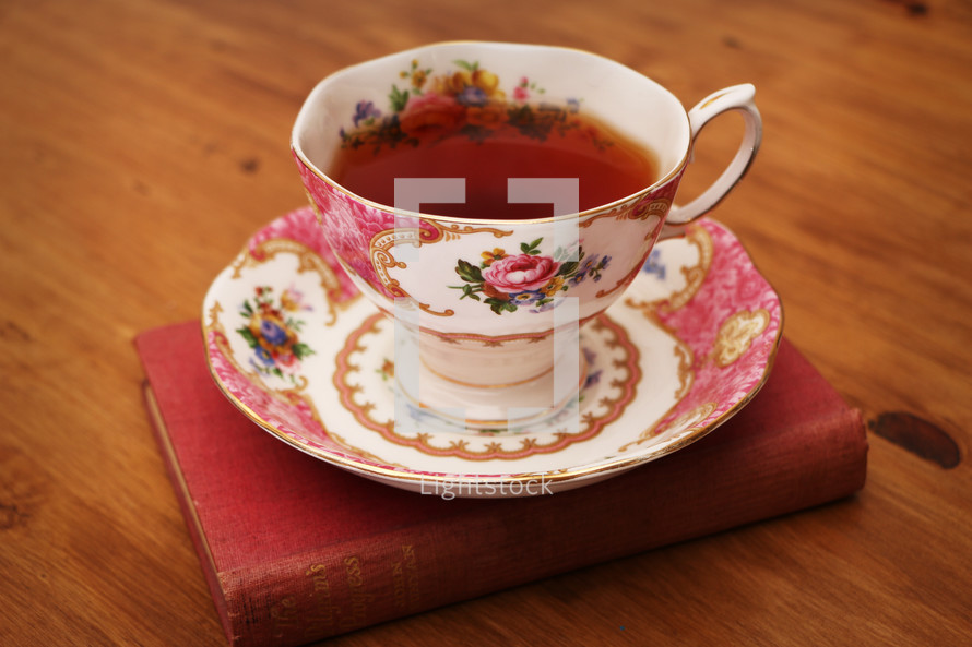 tea cup and saucer on a book 