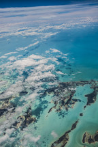 aerial view over islands below 