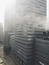 fog and skyscrapers in a city 