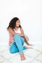 teen girl posing on a rug