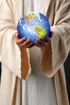 Jesus holding the world in his hands.