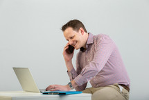 a man using a laptop computer 