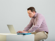 a man on a laptop computer 